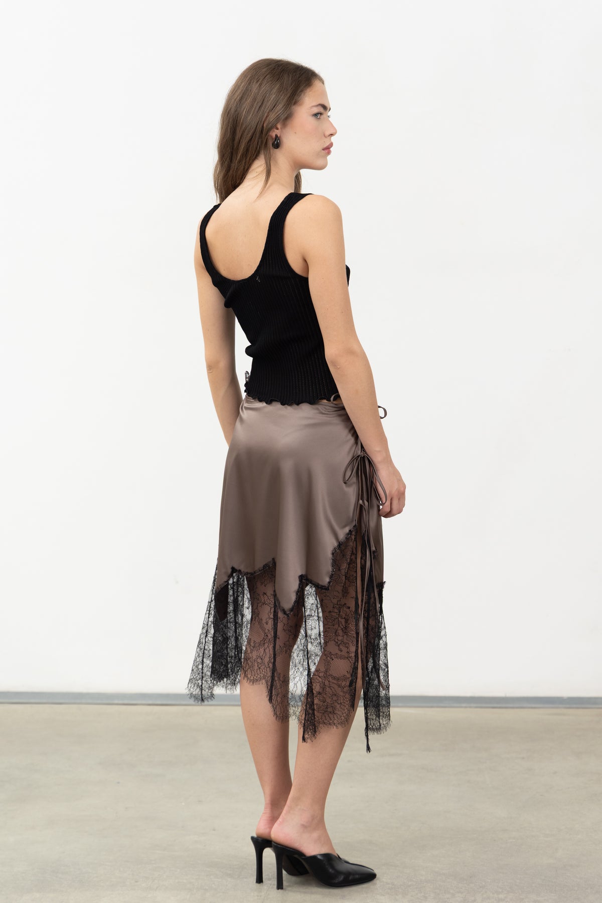 Back view of the Inferno Taupe Skirt in taupe viscose satin with black lace panels