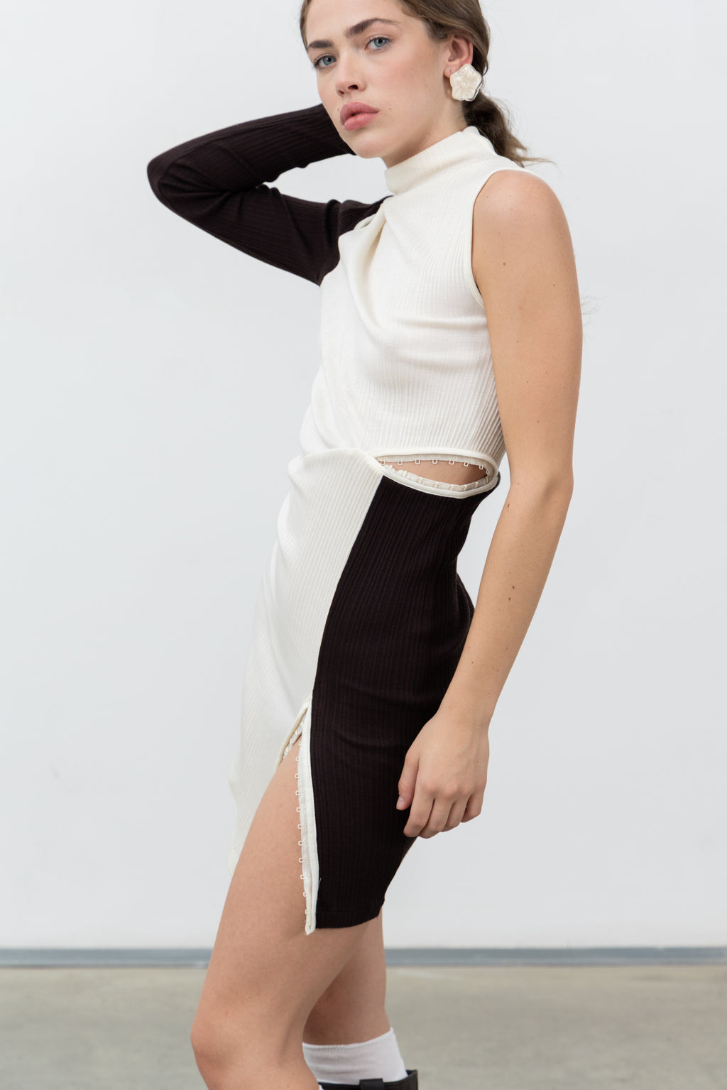 Side view of the III Top Dress showing the long contrast sleeve and waist opening