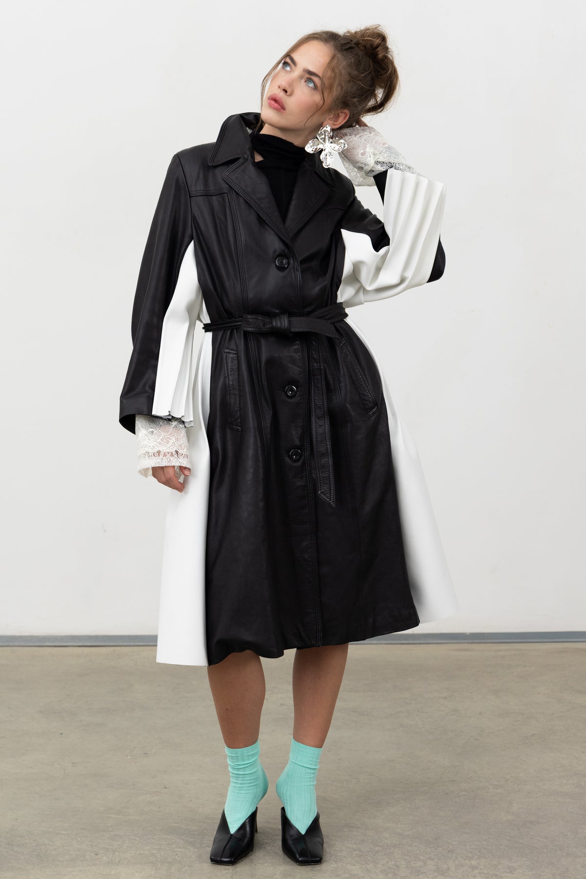 Full-length view of the Luxifer trench showing the white leather on the under-sleeves