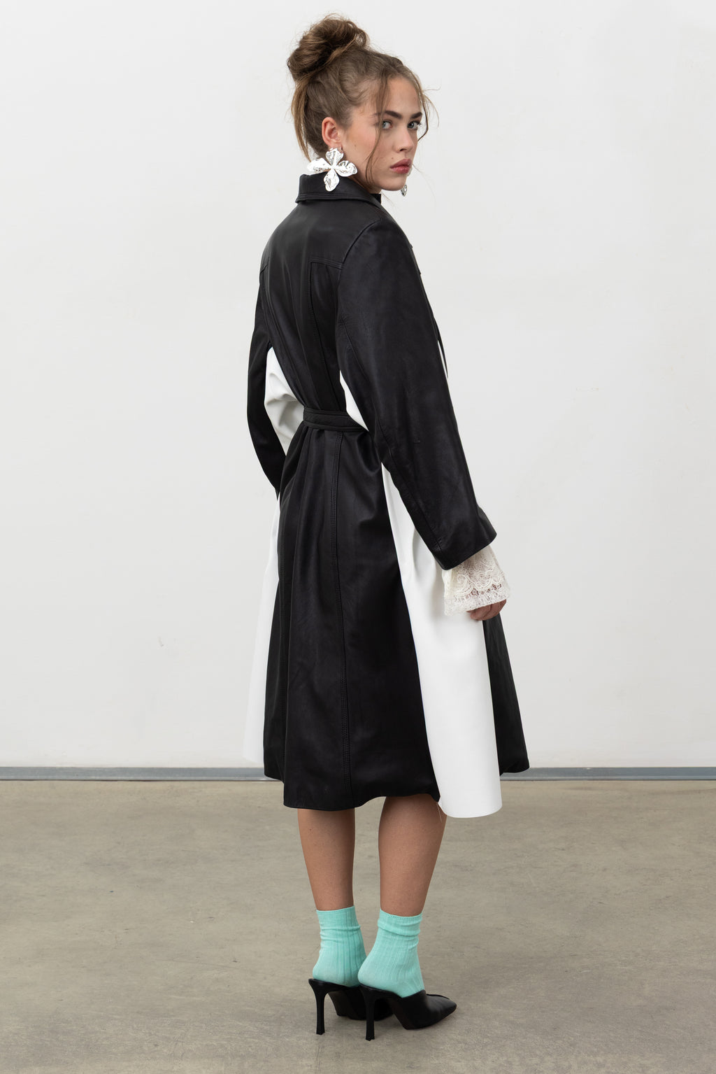 Back view of the Luxifer black leather trench