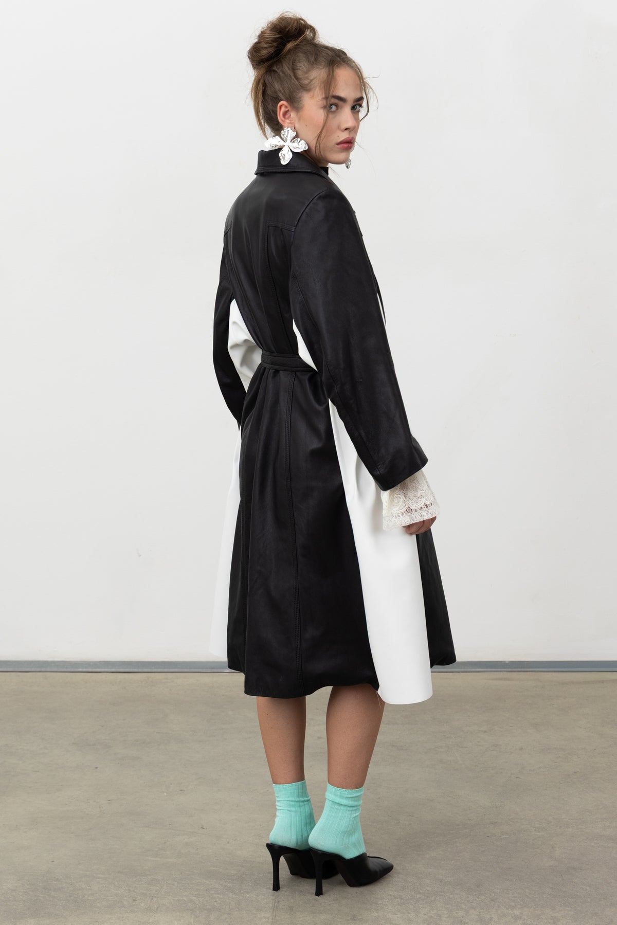 Back view of the Luxifer black leather trench