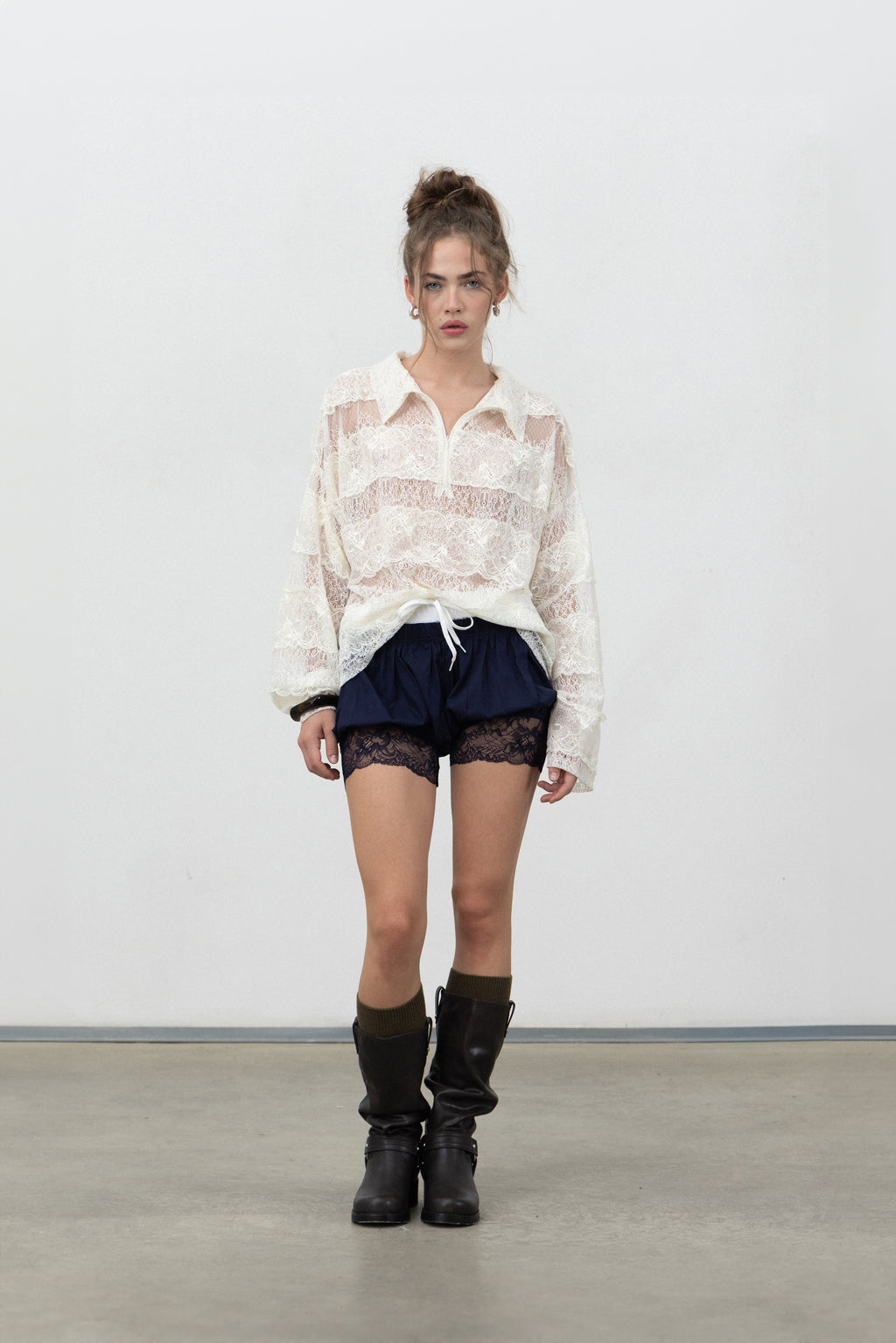 Full-length view of Saint Shorts Navy styled with the Sbagliato Light Top and boots