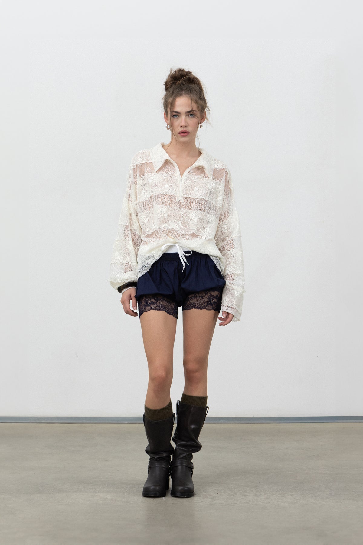 Full-length view of Saint Shorts Navy styled with the Sbagliato Light Top and boots