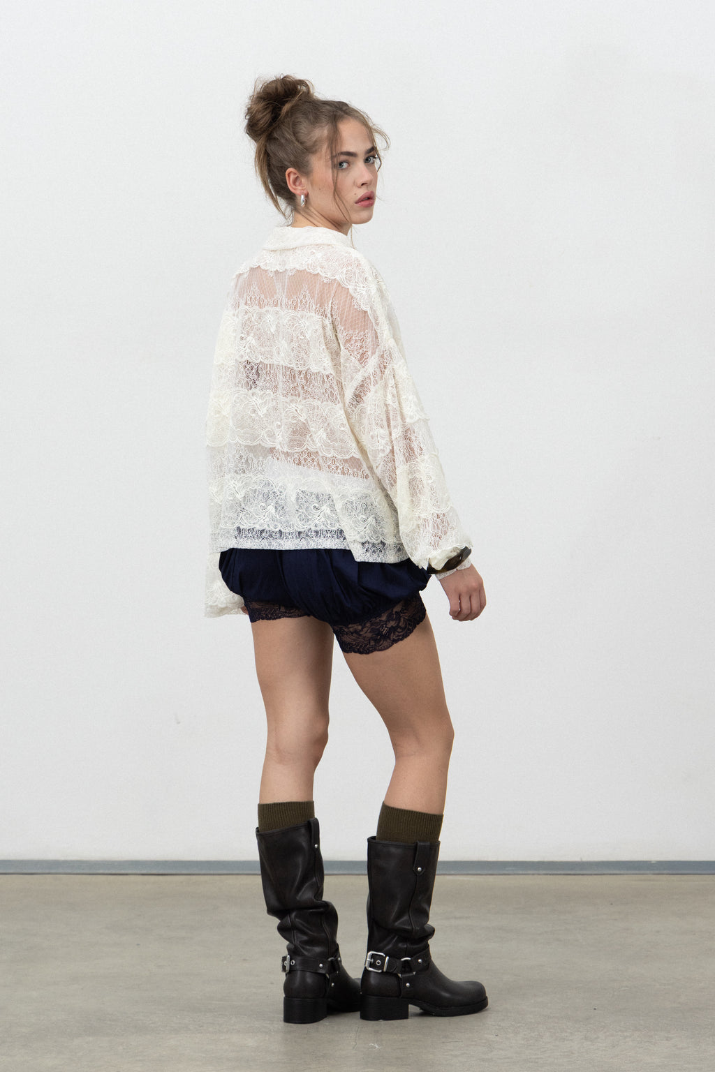 Back view of the navy Saint bloomer shorts with lace hem