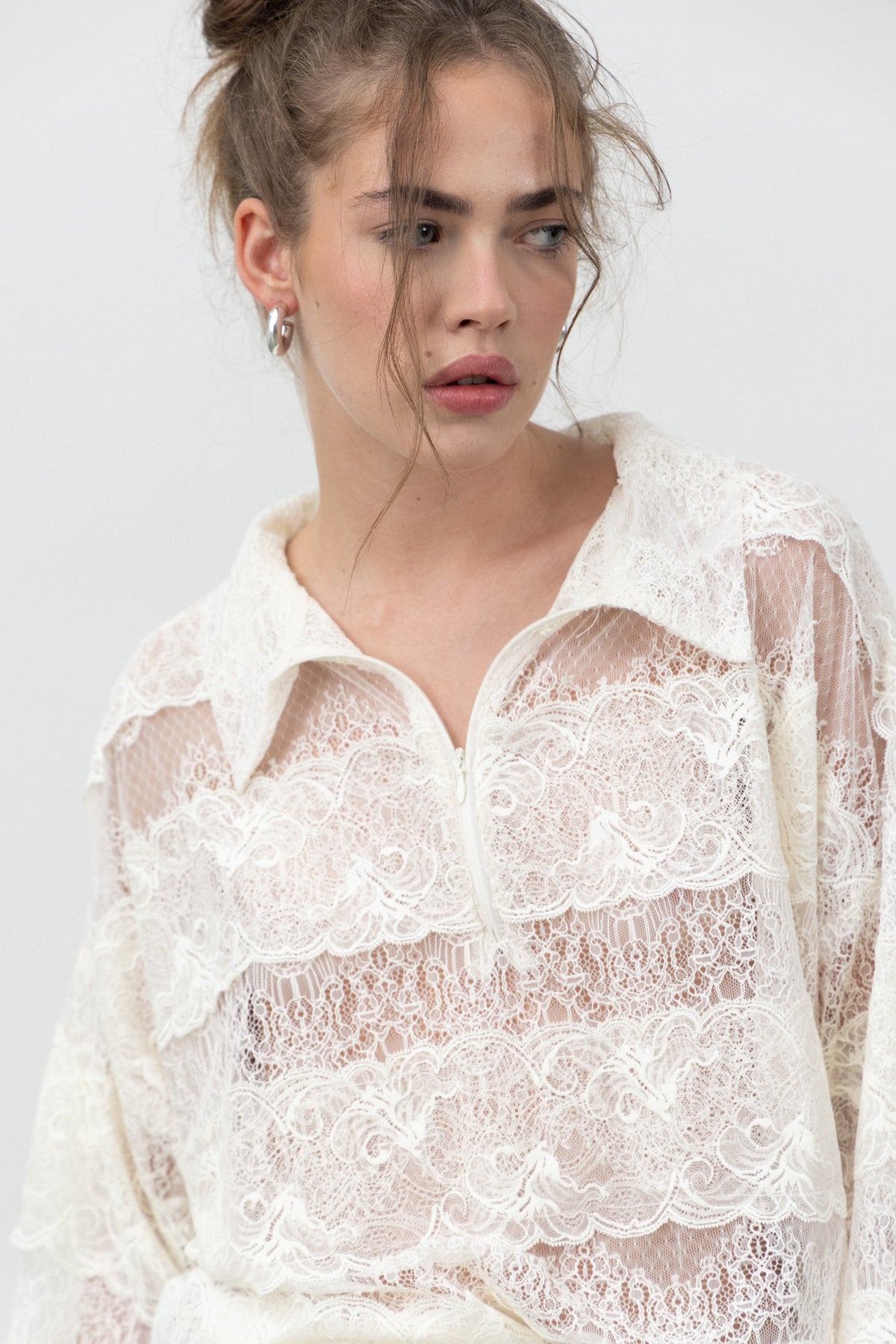 Close-up of the polo collar and raw lace bands on the Sbagliato Light Top