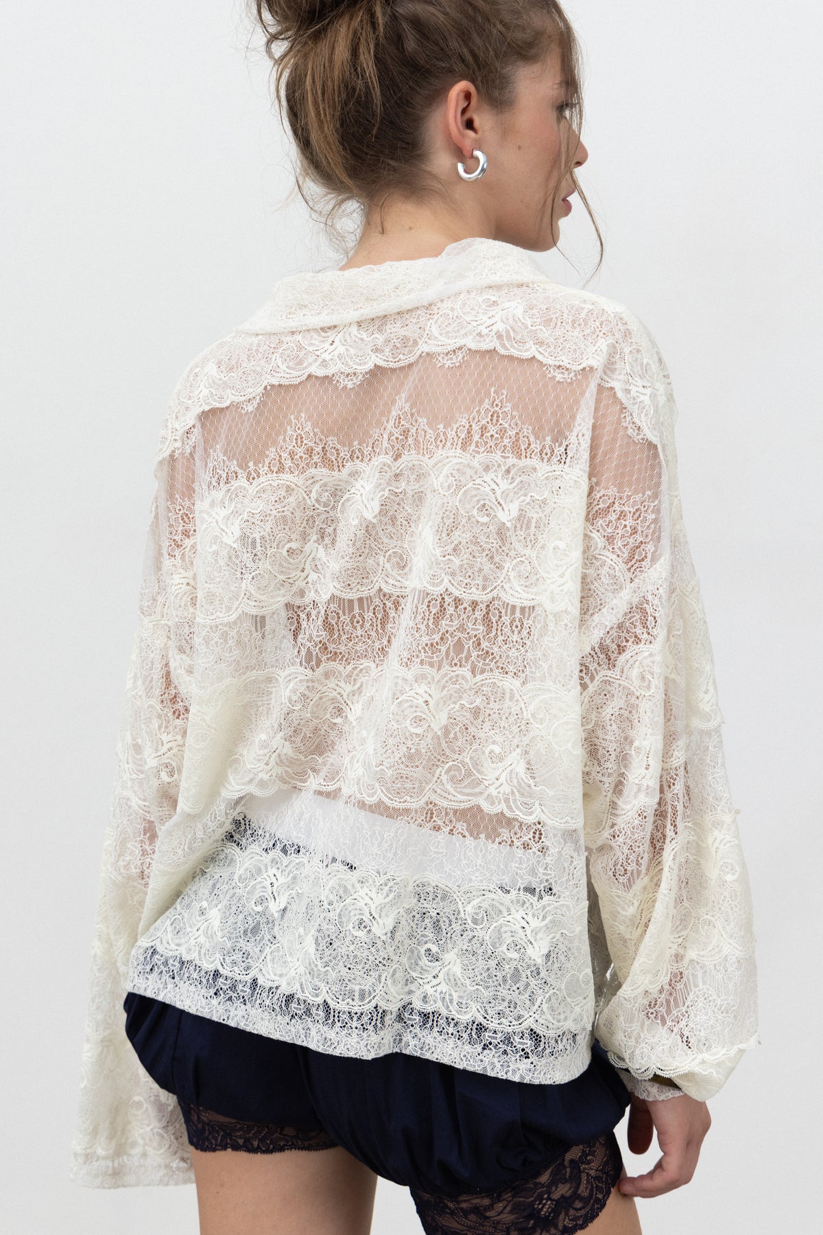 Back view of the Sbagliato Light Top showing sheer and denser lace stripes