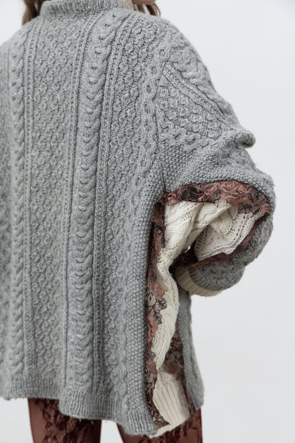 Back detail of the layered cuffs and lace on the Dimenticato Wool Cardigan