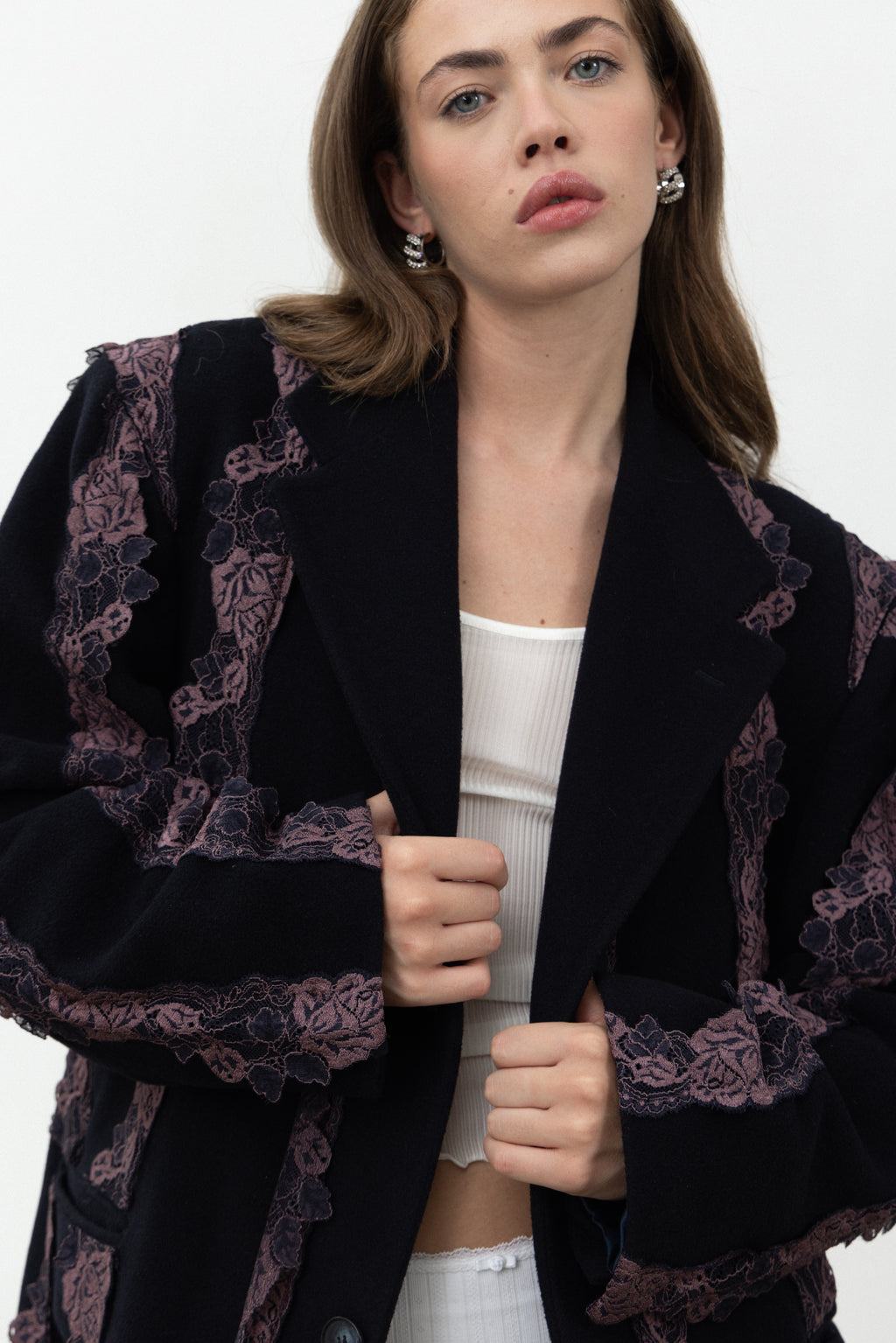 Close-up of the lapels and lace on the Rinascimento navy wool coat