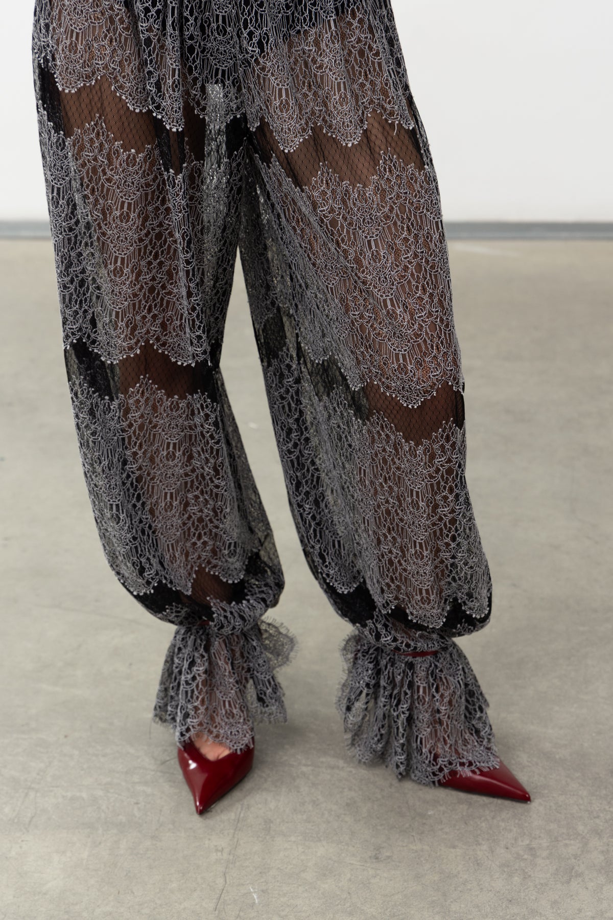 Detail of the gathered ruffled ankle cuffs on the Sbagliato Dark lace balloon pants