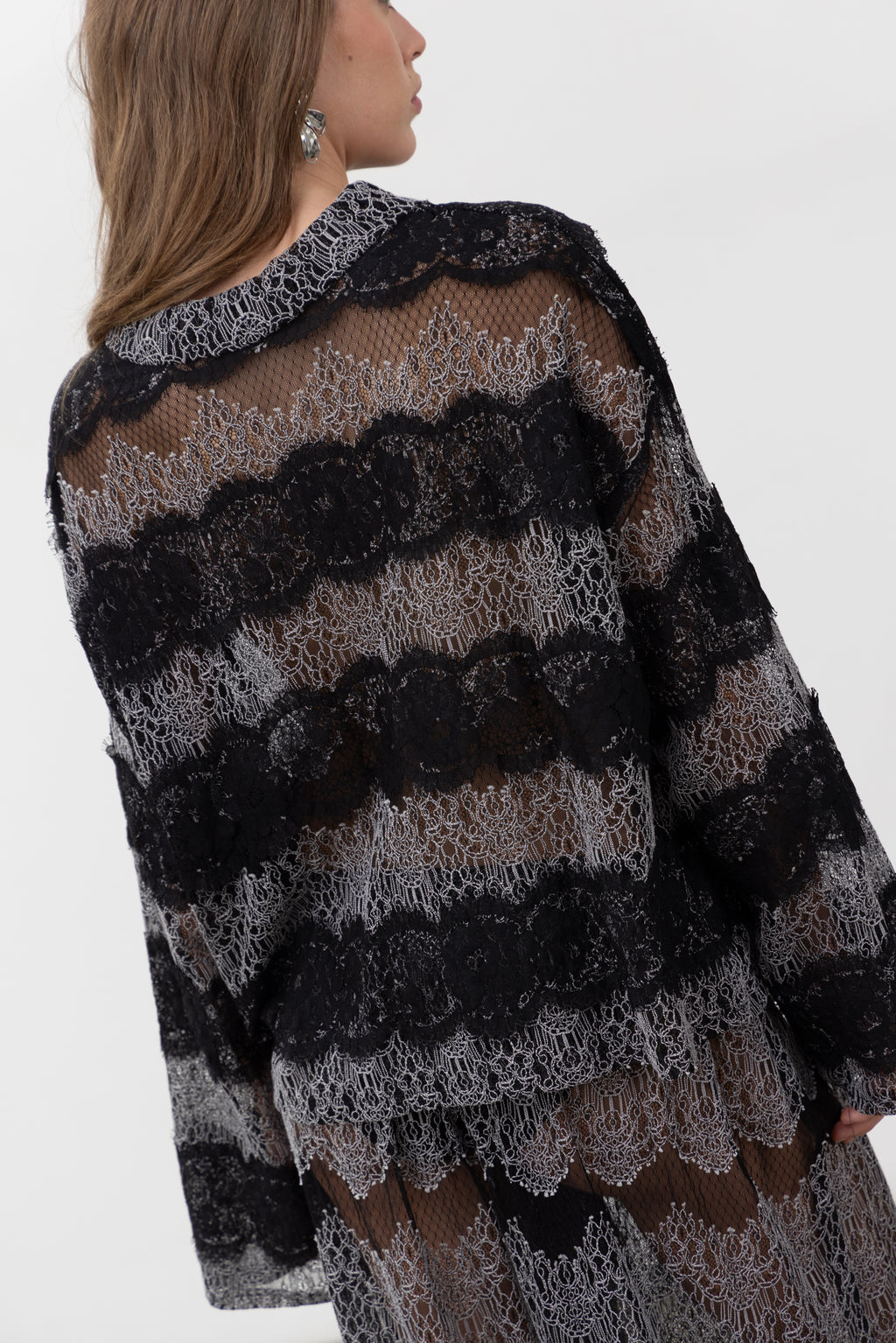 Back view of the oversized Sbagliato Dark lace polo top