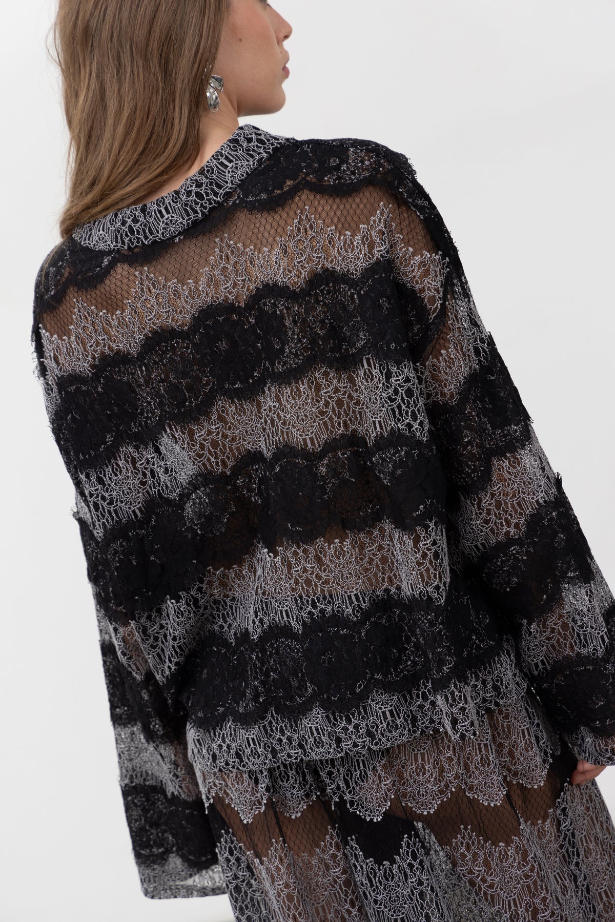 Back view of the oversized Sbagliato Dark lace polo top