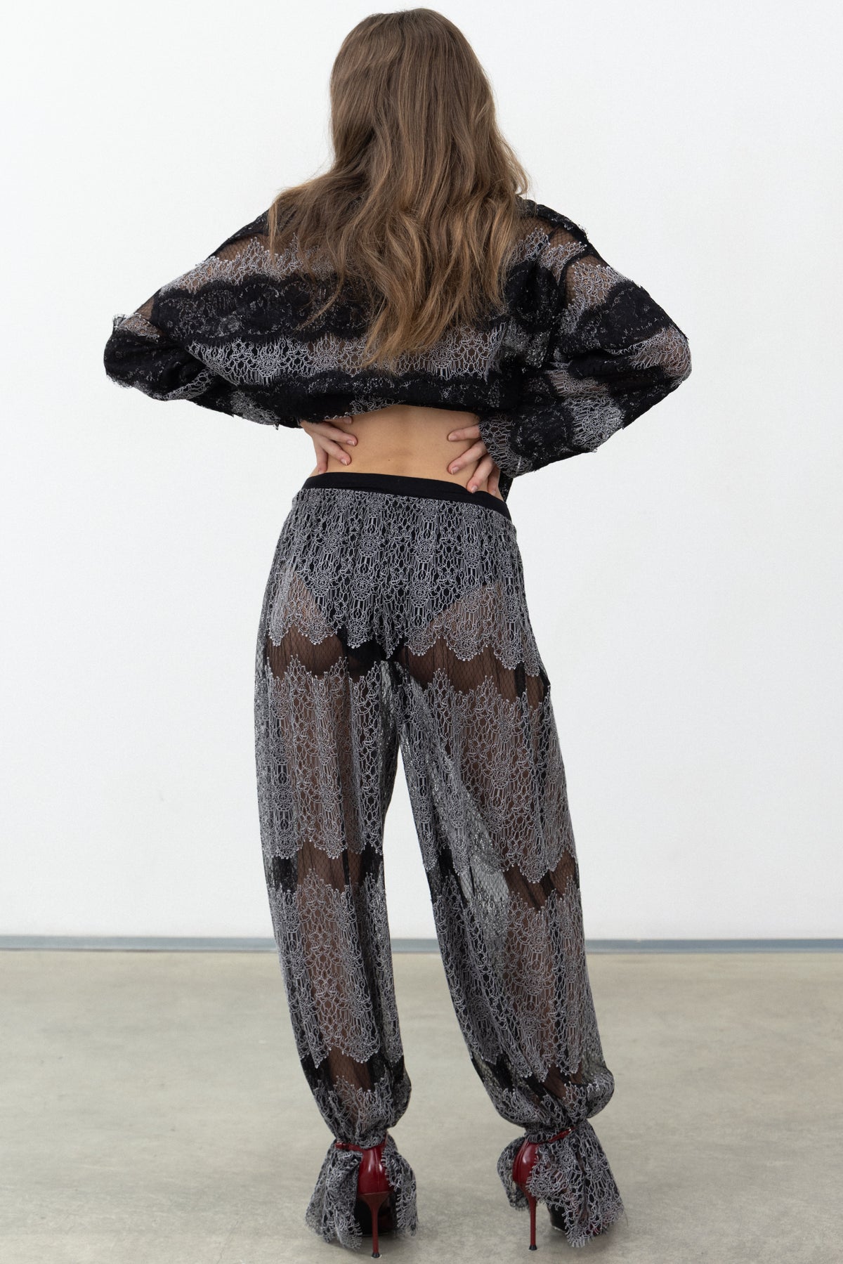 Back view of the Sbagliato Dark lace balloon pants with black waistband