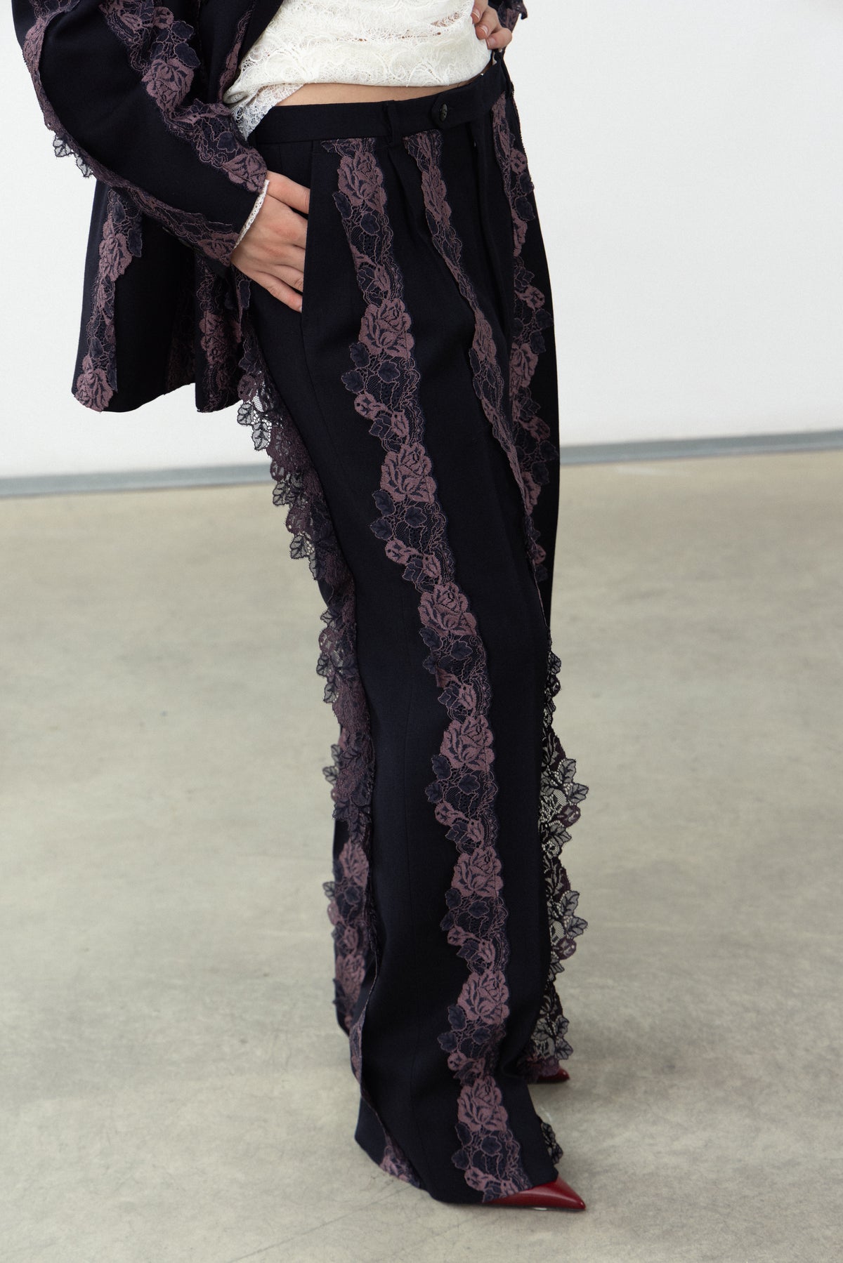 Detail of the purple lace bands down the leg of the Rinascimento Pants